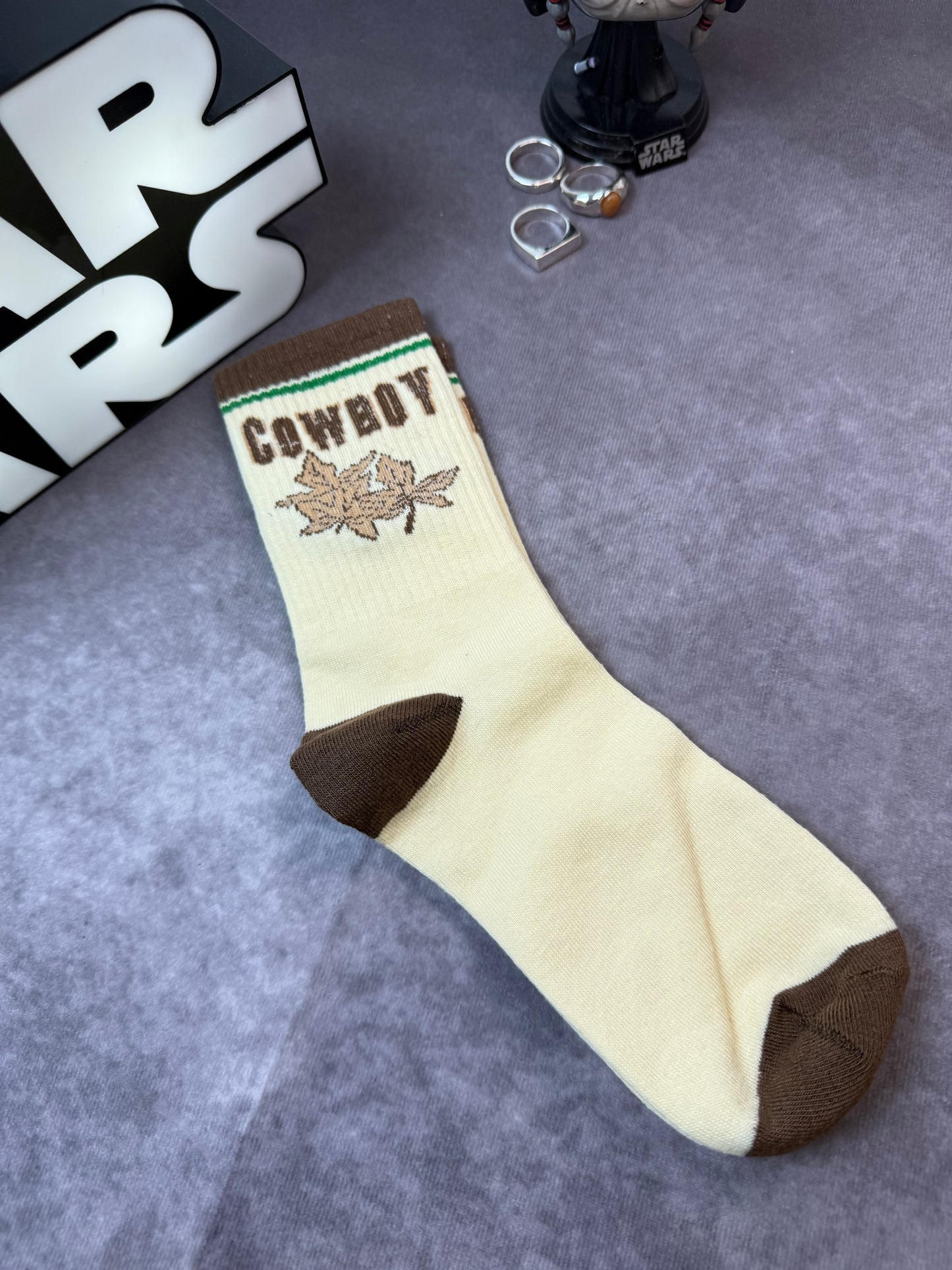 Socks With Letter And Geometric Patterns In Dark Brown Color.