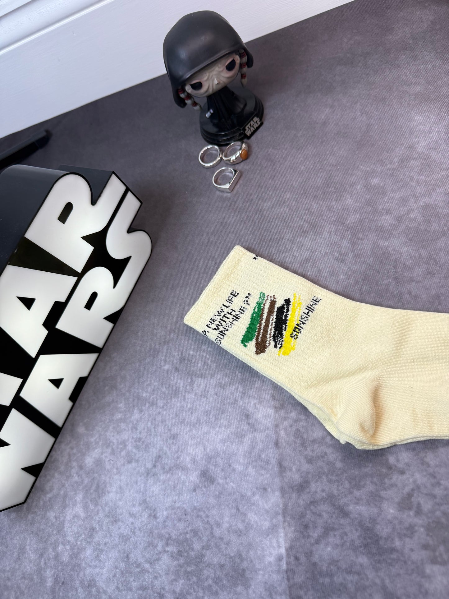 Socks With Letter And Geometric Patterns In Dark Brown Color.